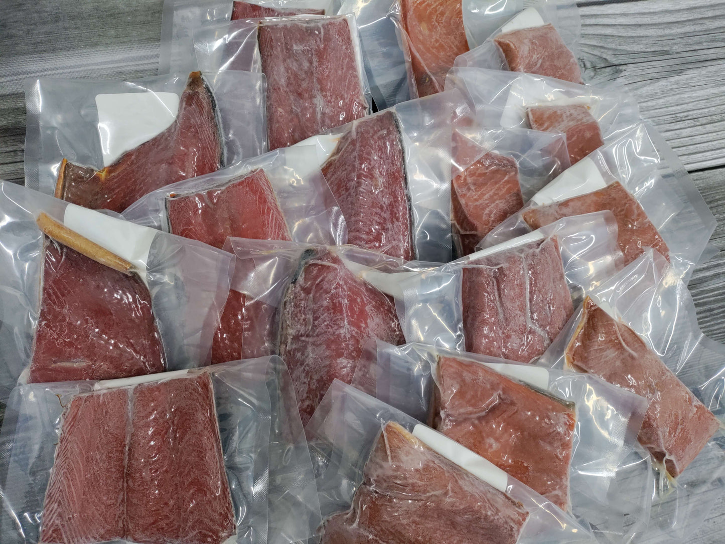 Assorted packaged smoked Wild Alaskan coho and sockeye salmon snack portions from a Kodiak Island Smokehouse Snack Box