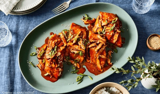 Alaska sablefish fillet glazed with gochujang marinade, plated over sticky white rice and topped with sautéed shiitake mushrooms, diced scallions, and toasted sesame seeds.