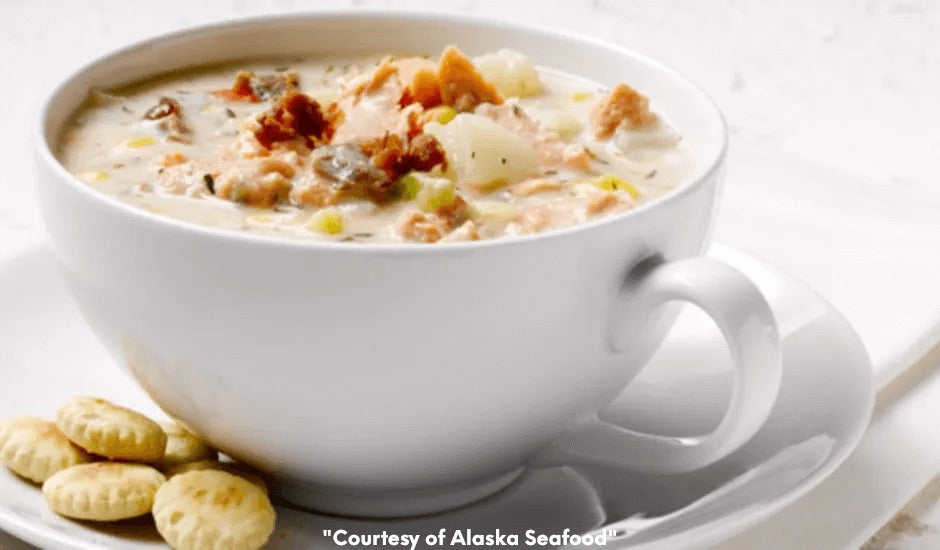 Bowl of creamy Alaska salmon chowder made with canned salmon, potatoes, and herbs, served warm with oyster crackers on the side.