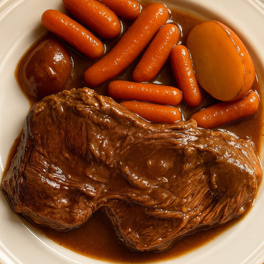 Slow-cooked game roast with carrots, red potatoes, and creamy mushroom gravy in a rustic dish.