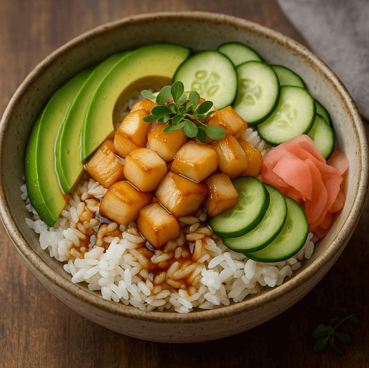 Smoked scallop poke bowl with avocado, cucumber, sushi rice, pickled ginger, and soy-lime dressing in a ceramic bowl.