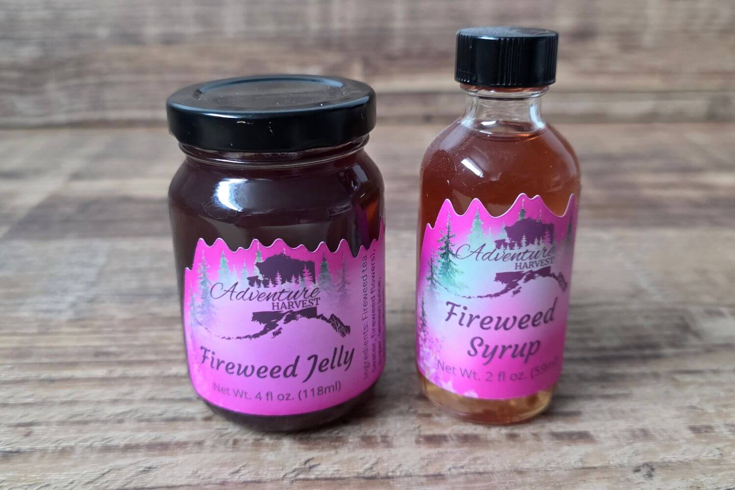 Wild Alaskan fireweed jelly and fireweed syrup from Adventure Harvest on a wooden background
