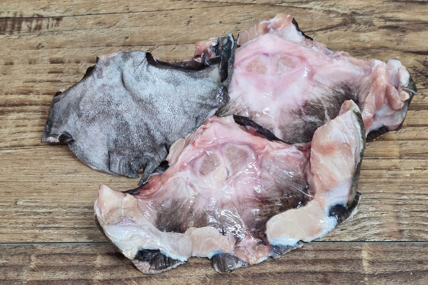 Black Cod Collars on rustic wood table.
