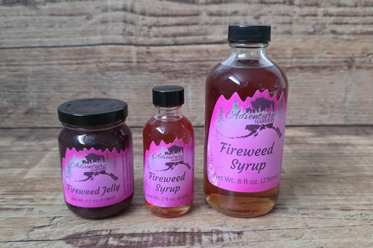 Wild Alaskan fireweed jelly and fireweed syrup from Adventure Harvest on a wooden background