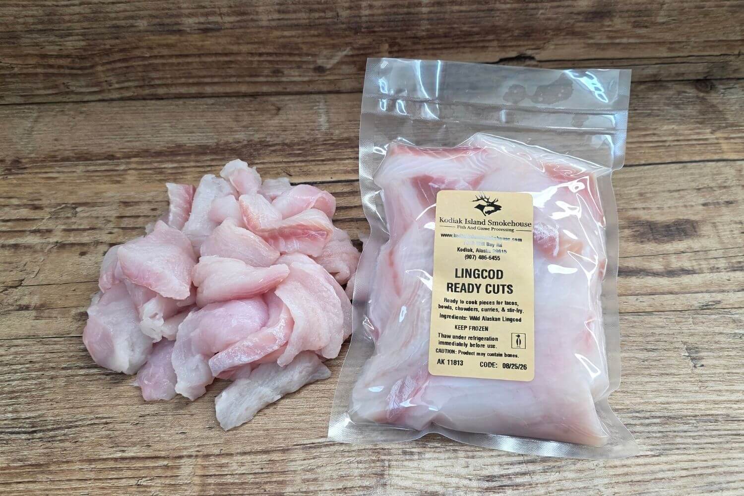 Kodiak Island Smokehouse Lingcod Ready Cuts in a vacuum-sealed 1 lb package with loose wild Alaskan lingcod pieces beside it.