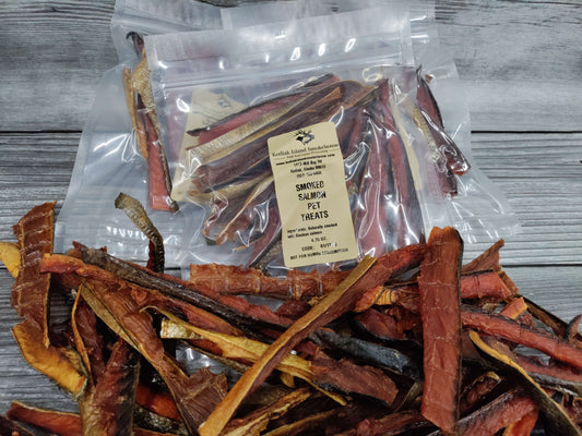 Bags of smoked salmon pet treats with visible dried salmon strips.
