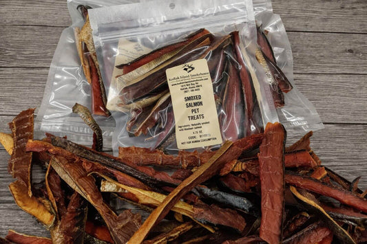 Bags of smoked salmon pet treats with visible dried salmon strips.