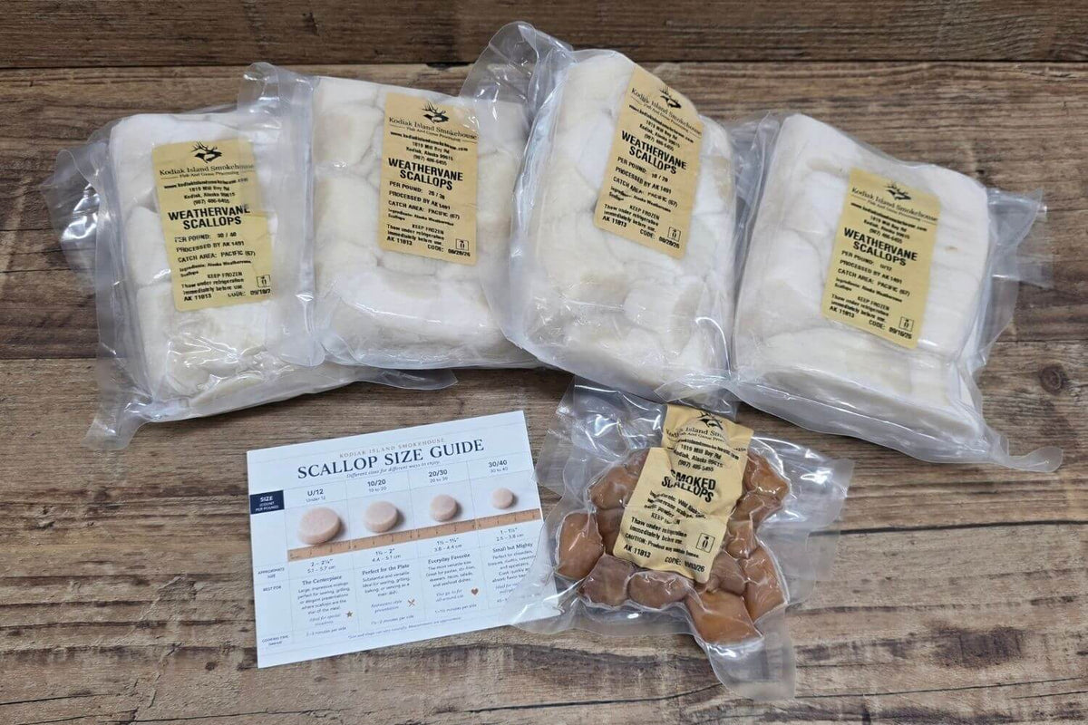 Kodiak Island Smokehouse Scallop Collection featuring four vacuum-sealed packages of Alaska weathervane scallops, smoked scallops, and a scallop size guide on rustic wood.